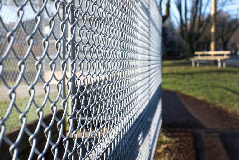 Chain link fencing installed by Fortitude Fencing, providing a secure and visible enclosure for residential or commercial properties.